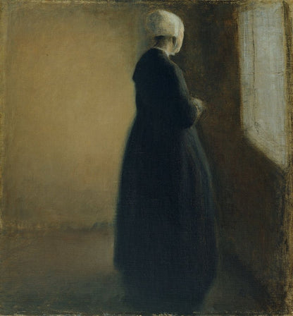 An old woman standing by a window - by Vilhelm Hammershøi