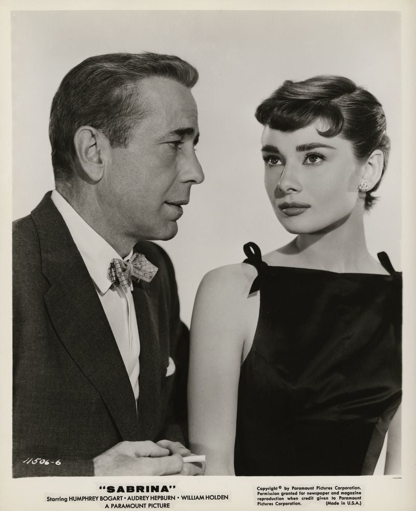 Humphrey Bogart and Audrey Hepburn in "Sabrina" (Paramount, 1954).- Movie Poster Reprint