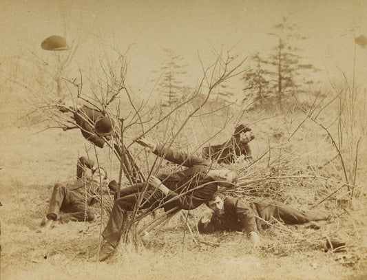 Four male students reclining al fresco - by Thomas Eakins