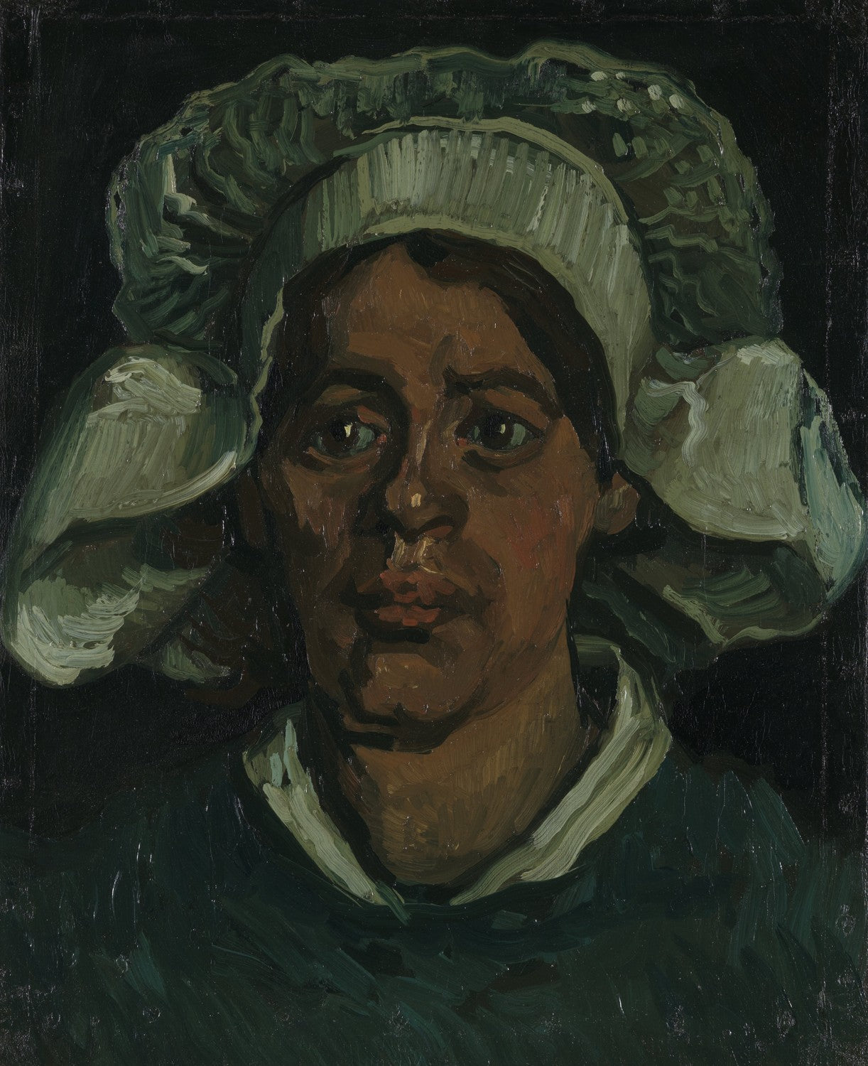 Head of a woman wearing a white cap by Vincent van Gogh