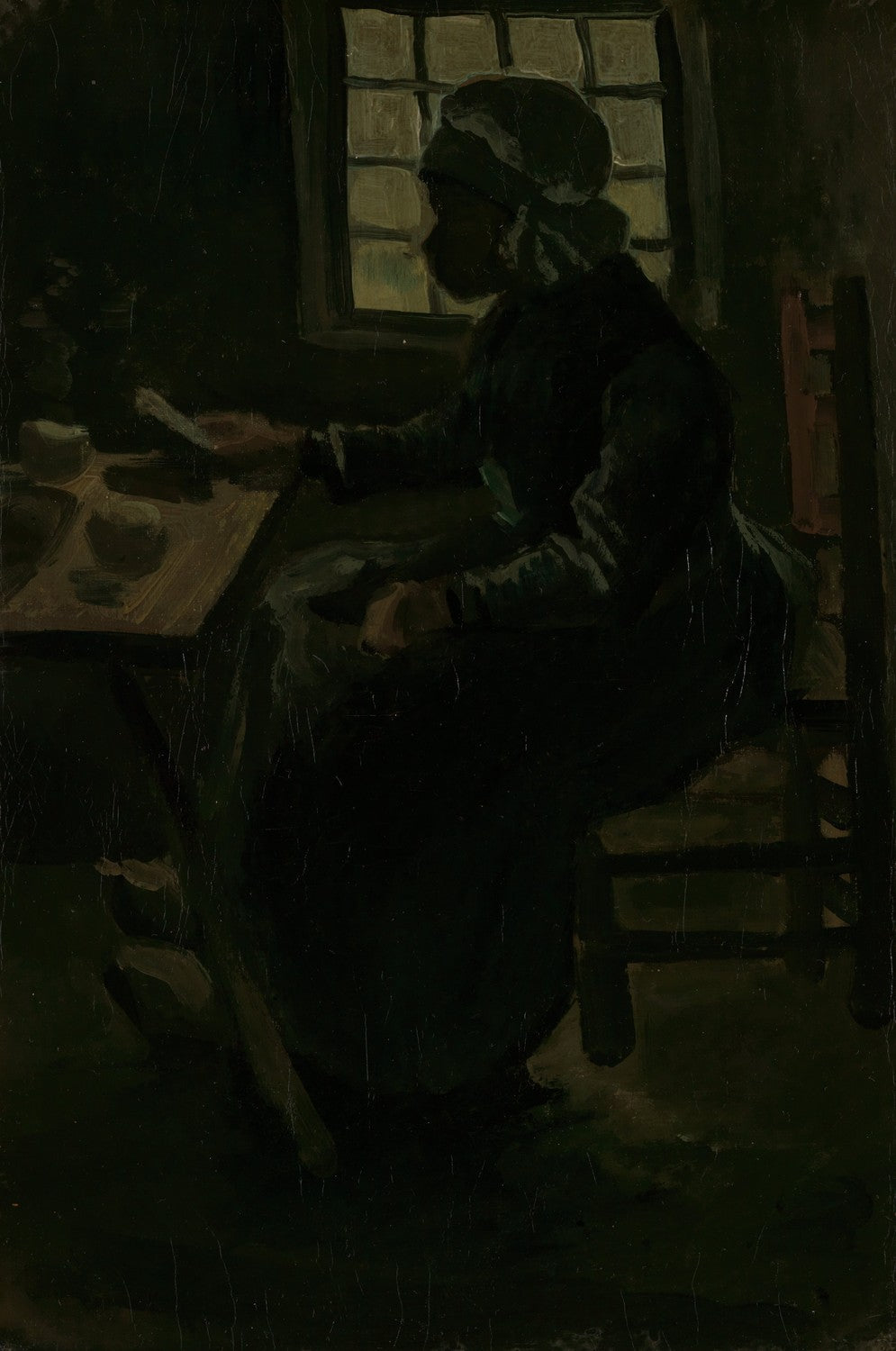 Woman at table by Vincent van Gogh